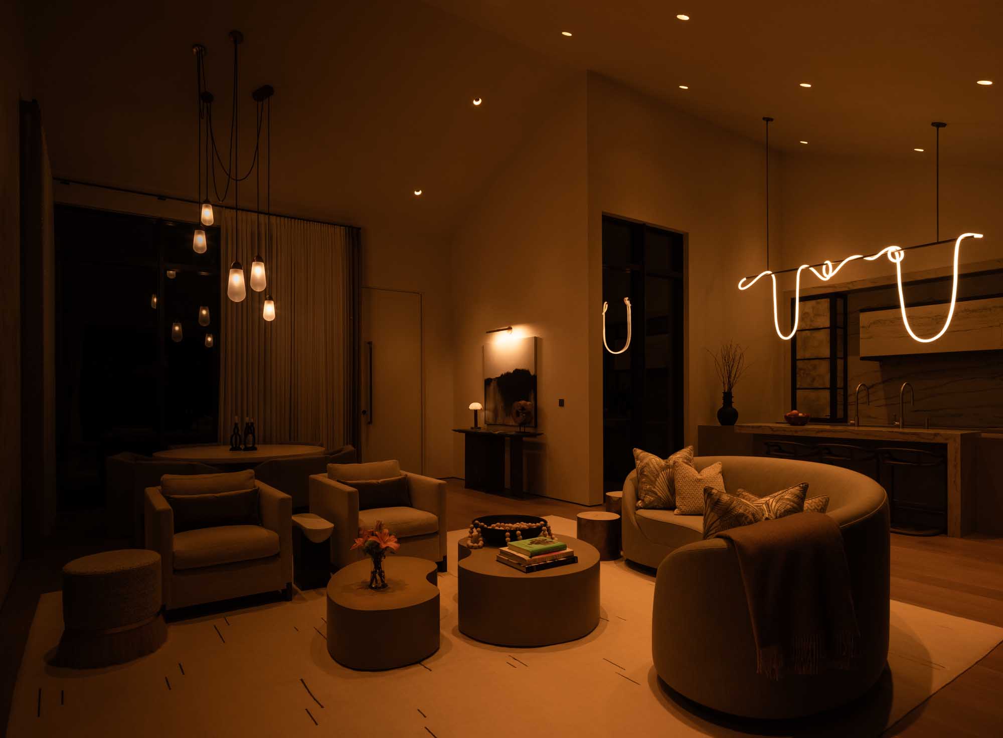 Living room at night with warm dim lighting and modern furniture