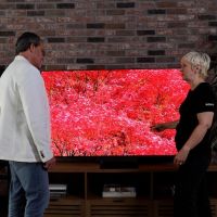 Kathleen Thomas from Sony and Lee Travis from Wipliance standing in front of the Sony BRAVIA 9 II RGB LED TV.