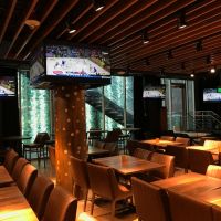 A restaurant interior with warm Ketra lighting illuminating the space.